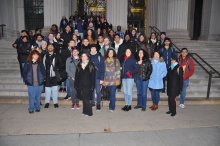 student group photo standing on the main steps of MIT 