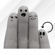 fingers with faces drawn on them interacting