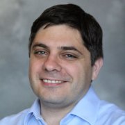 headshot of George Konidaris in blue shirt